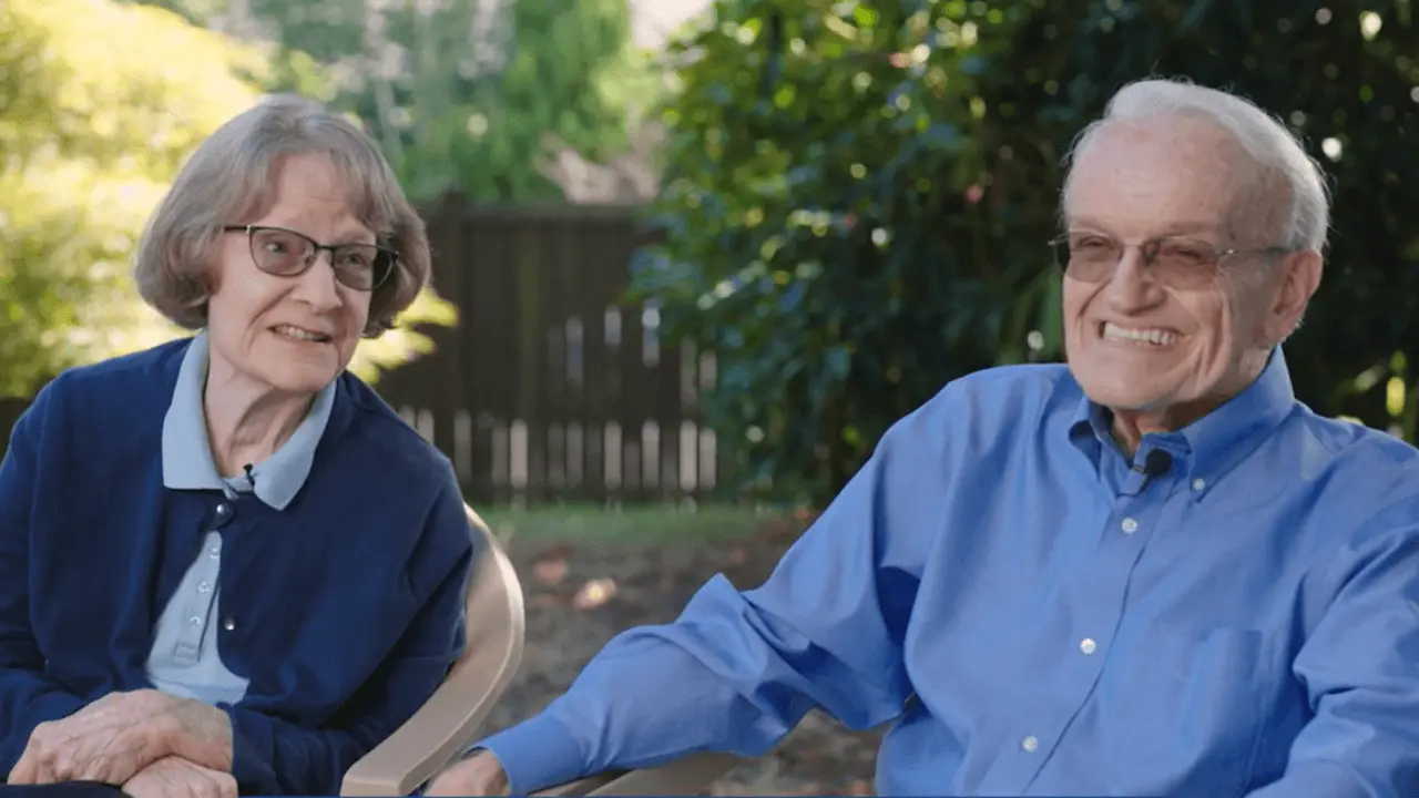 Parents of a Community Homes resident smile while sharing their experience
